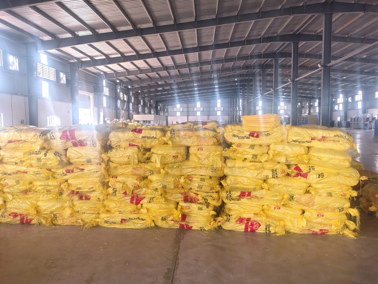 Stacked bales of finished cement bags in warehouse